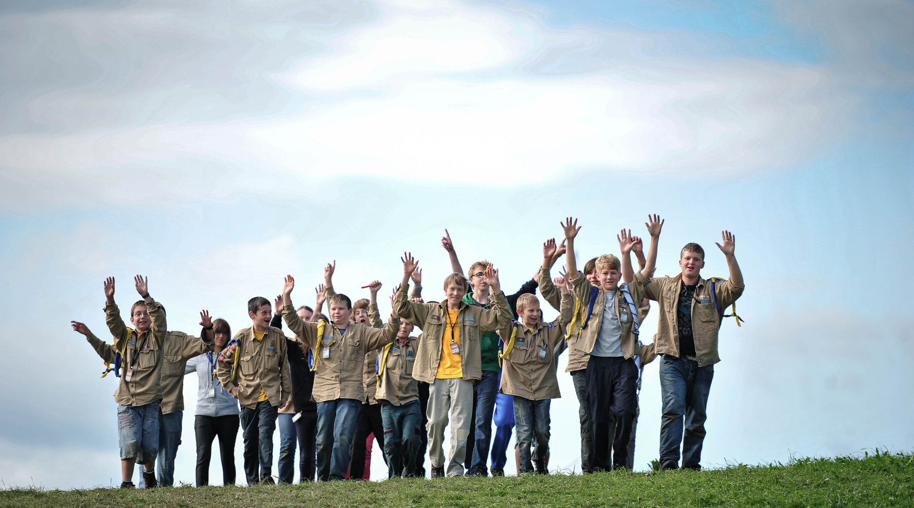 Scouts walk across meadow